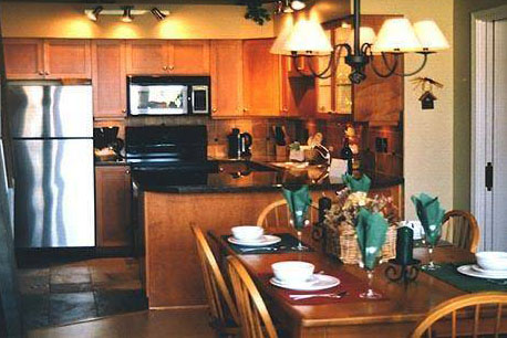 Kitchen and dining area in a Greystone Lodge condo