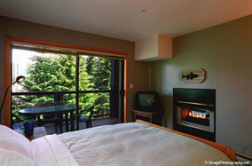Powderhorn in Whistler master bedroom with fireplace.