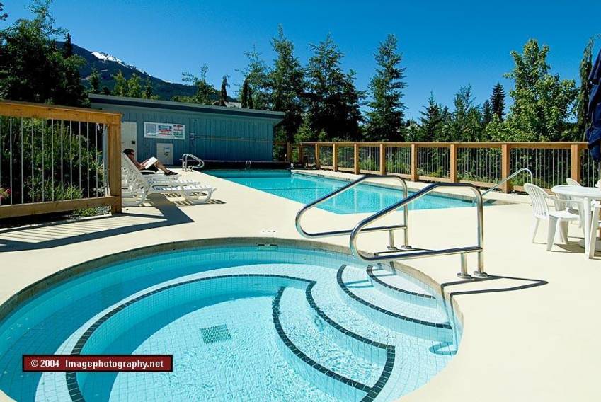 Outdoor pool and hot tub at Whistler Racquet Club near Montebello