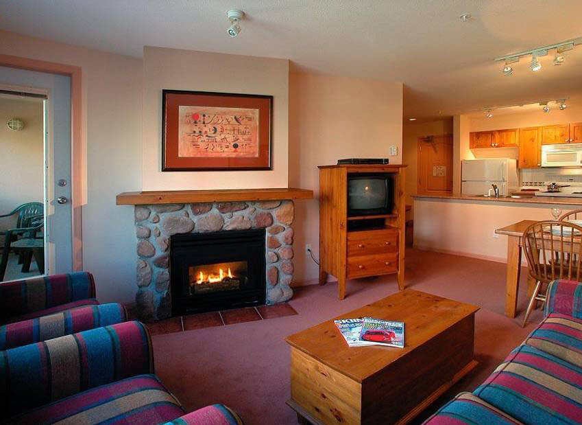 Relax in front of the stone fireplace after a long ski day