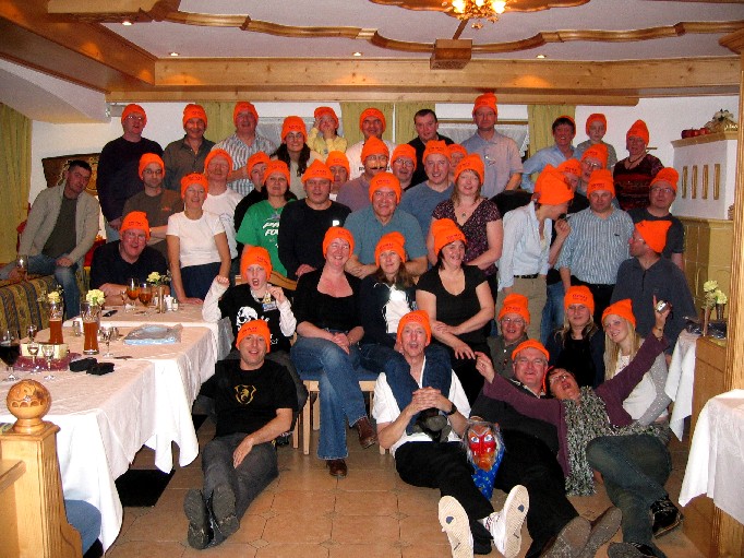 Ski club members in orange hats